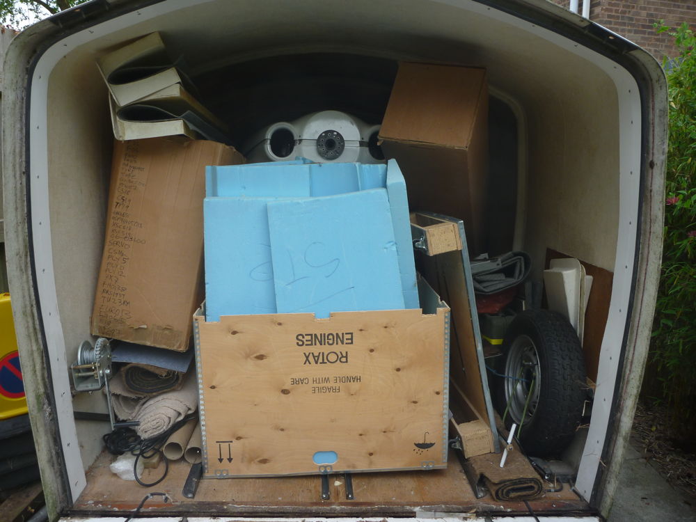 fuselage in trailer with boxes